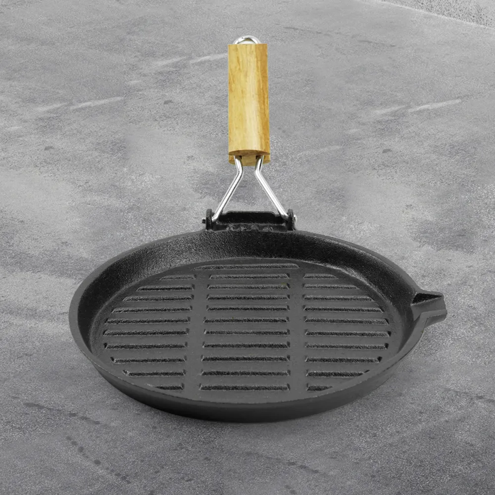 Round cast iron baking tray with folding handle, suitable for meat, fish and vegetables