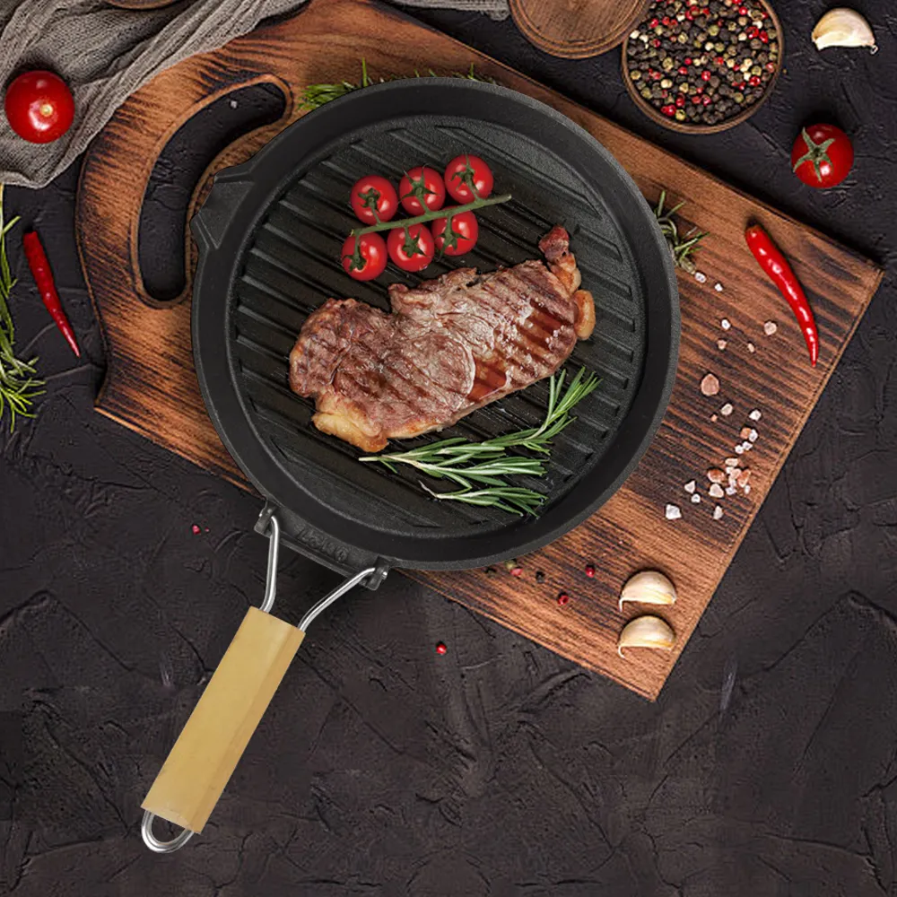 Round cast iron baking tray with folding handle, suitable for meat, fish and vegetables