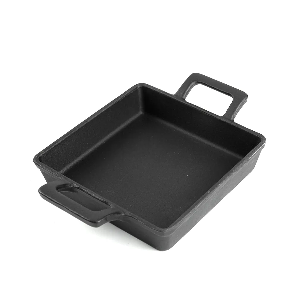 Cast iron mini frying pan with double ears, suitable for both indoor and outdoor use.