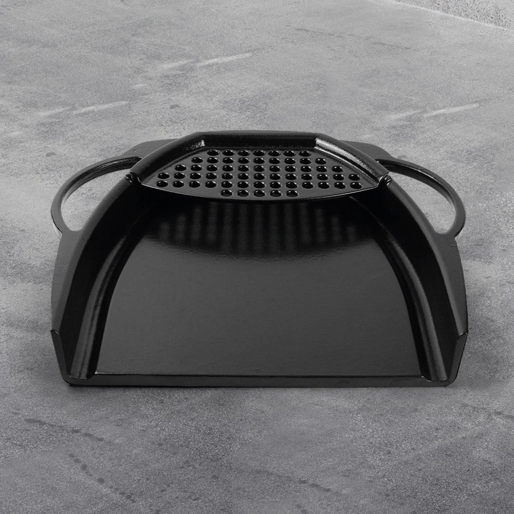 A wide enamel cast iron baking tray