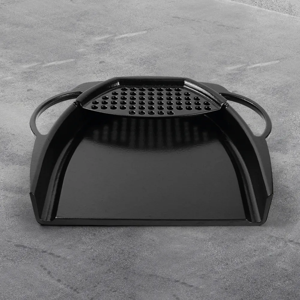 A wide enamel cast iron baking tray