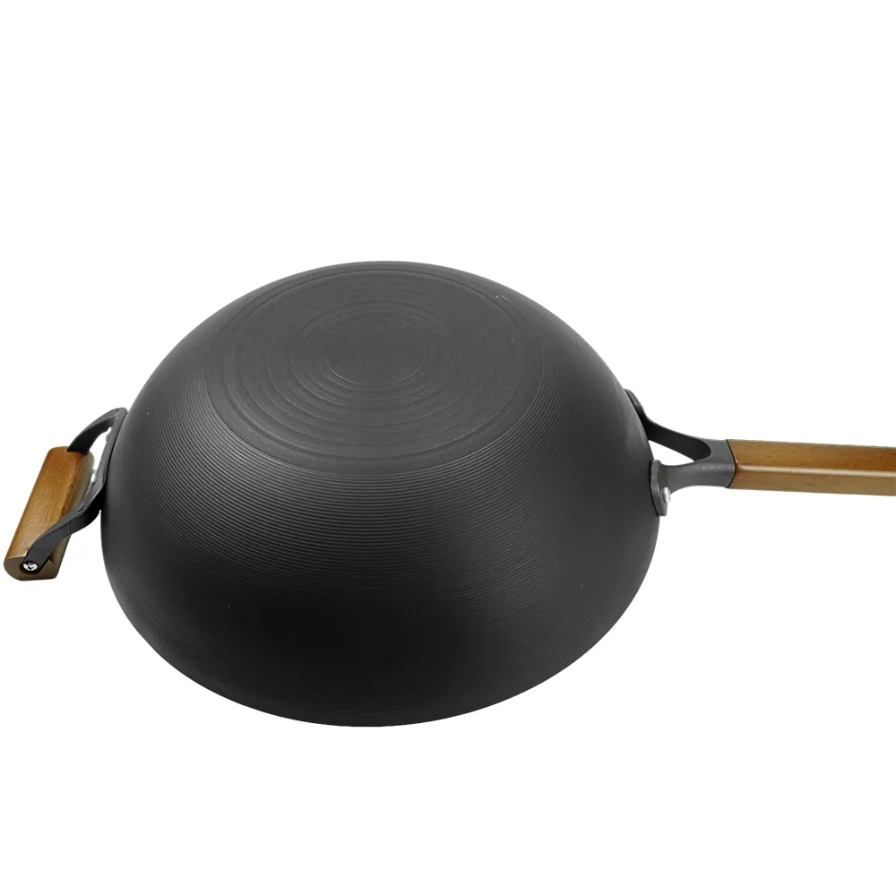 Nitrided cast iron wok with auxiliary handle