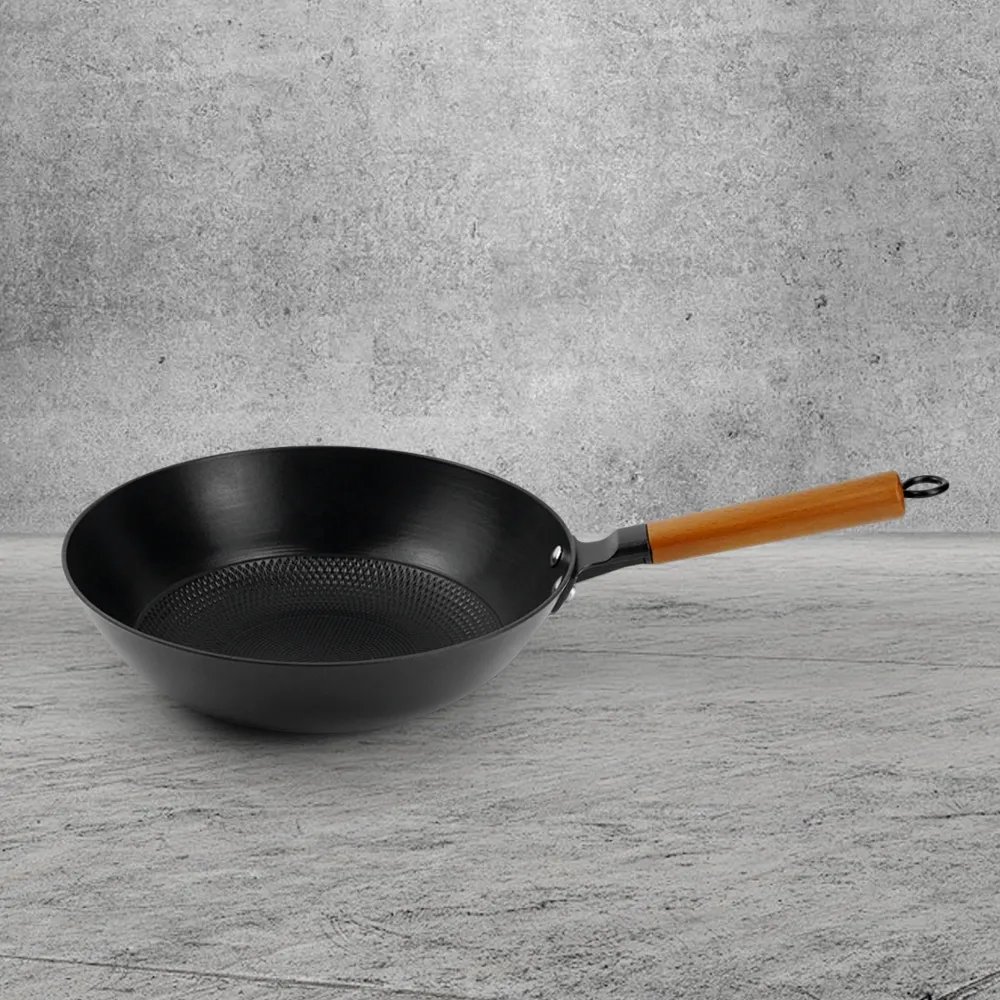 A low-fat, non-stick cast iron wooden-handled wok